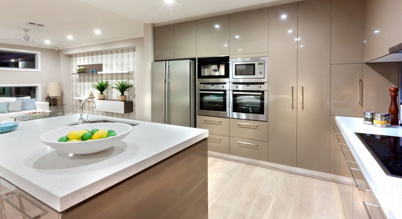 Modern kitchen area illuminated with lights at night